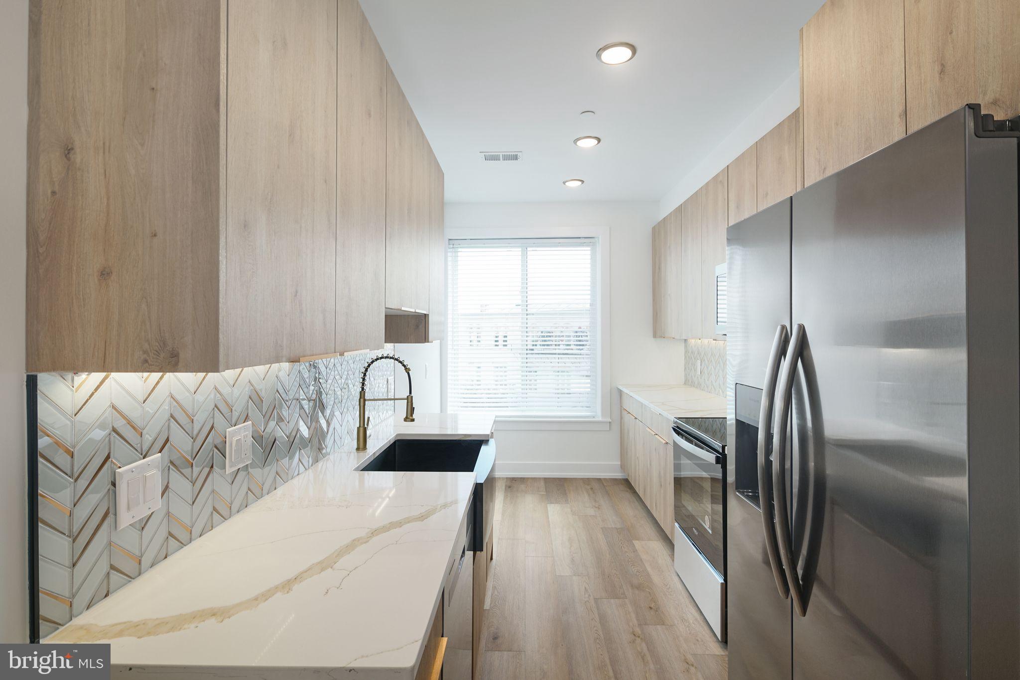 2000 North Front Street, Unit 5 Philadelphia, PA 19122 - Photo 5 of 10 a living room with furniture and a large window