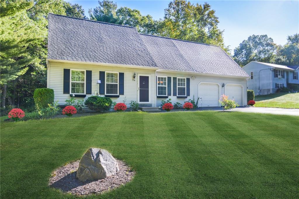 774 Cook Hill Road Killingly, CT 06239 - Photo 1 of 1 a front view of house with yard and outdoor seating