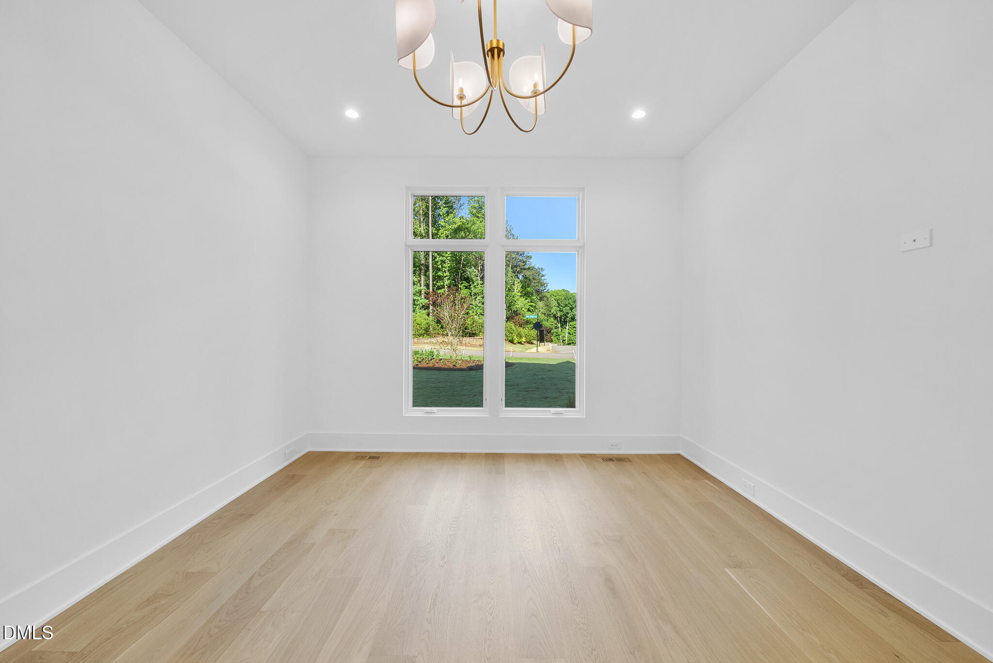 7608 Falls Creek Lane Raleigh, NC 27614 - Photo 63 of 74 an empty room with wooden floor and windows