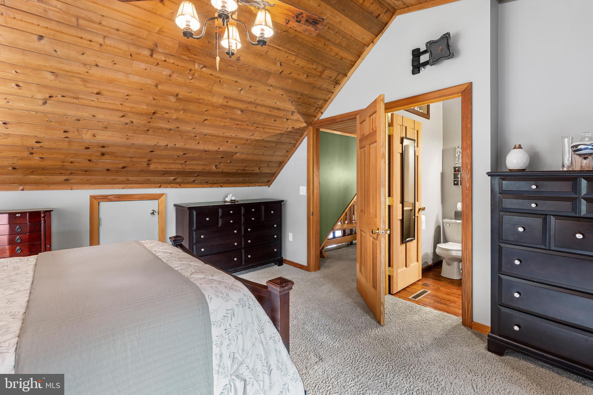 491 Sheep Hill Road Newmanstown, PA 17073 - Photo 20 of 30 a spacious bedroom with a bed and a dresser