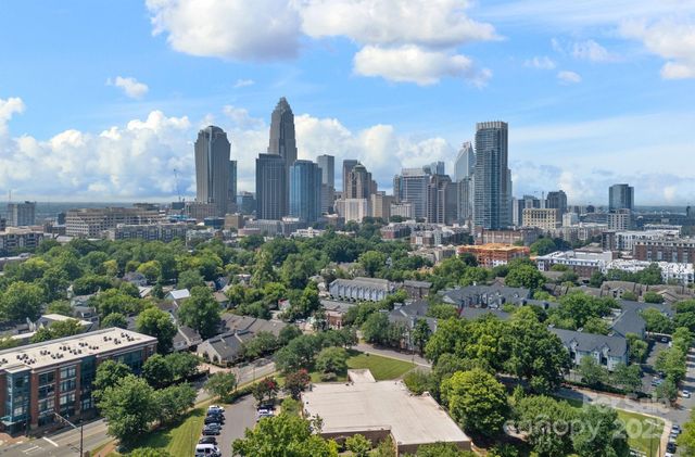a view of a city with tall buildings