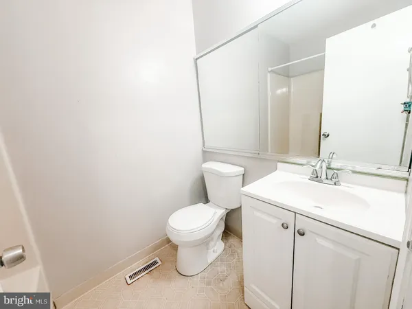a bathroom with a sink toilet and vanity