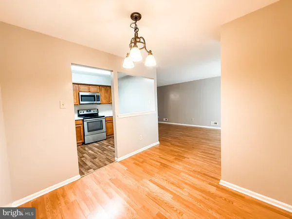 a view of kitchen and wooden floor