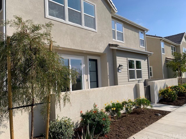 340 Chorus Irvine, CA 92618 - Photo 1 of 1 a front view of a house with a garden