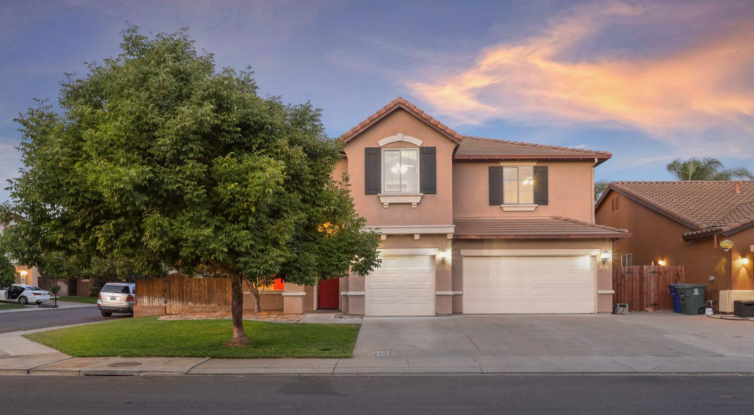 3020 Collingham Court Modesto, CA 95355 - Photo 1 of 1 a front view of a house with a yard and garage