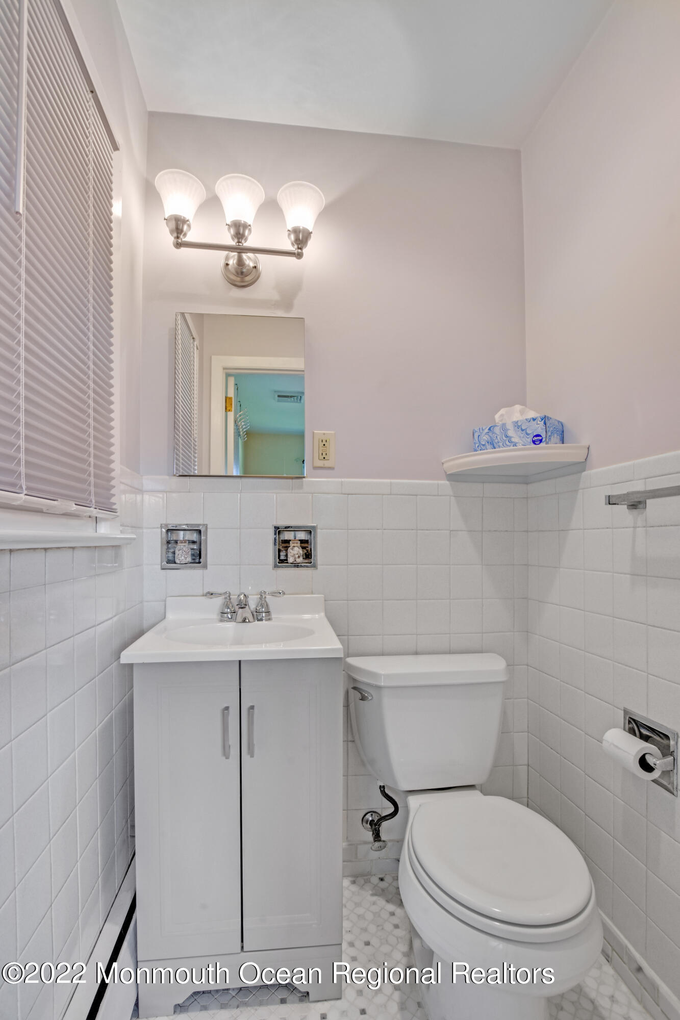3301 B River Road Point Pleasant, NJ 08742 - Photo 11 of 20 a bathroom with a toilet a sink and mirror