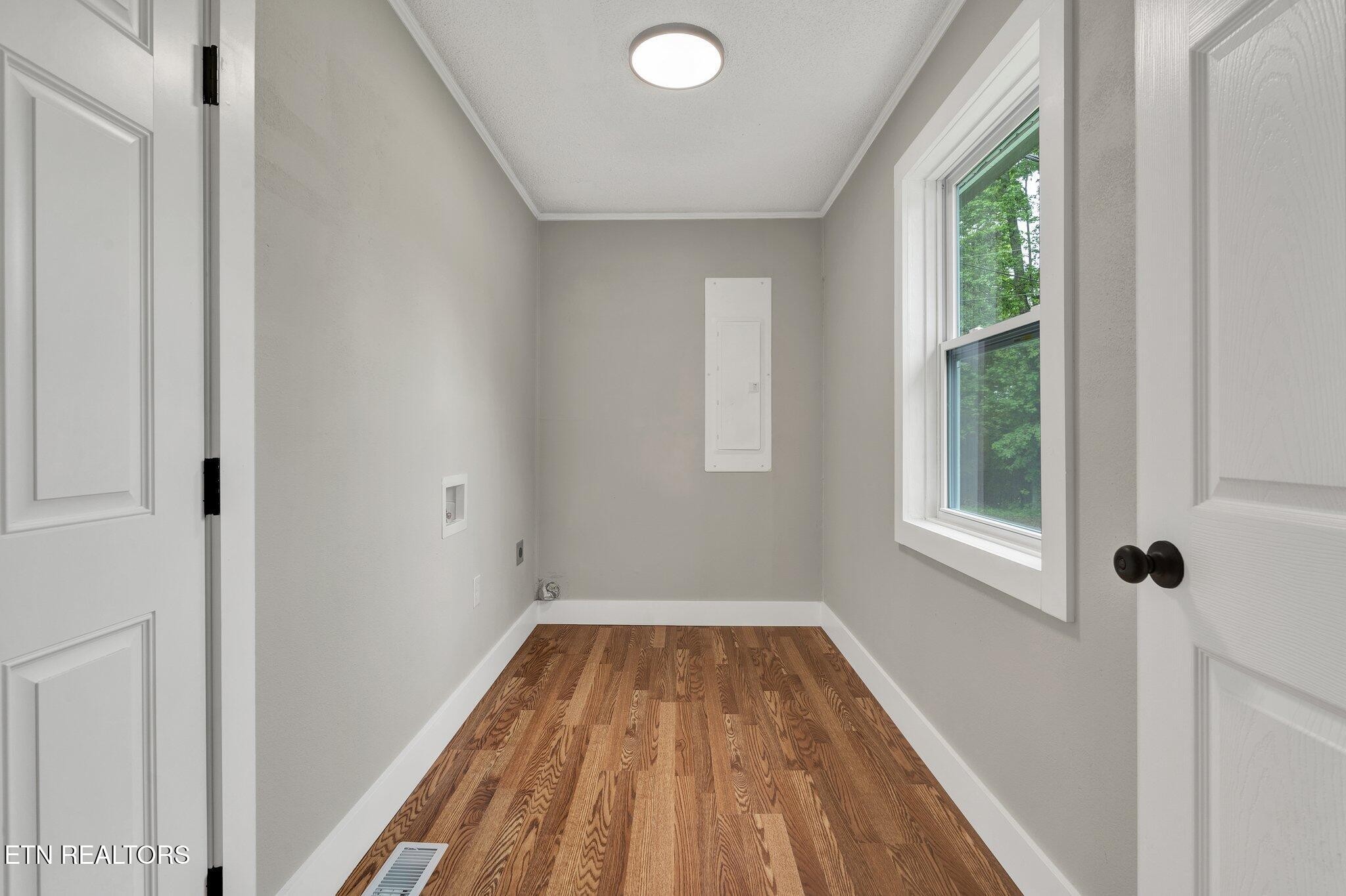 12408 North Nopone Valley Road Decatur, TN 37322 - Photo 11 of 54 a view of a room with wooden floor and windows