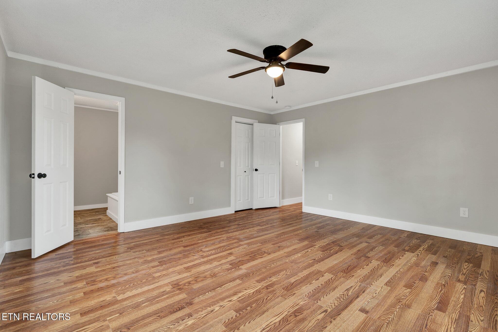 12408 North Nopone Valley Road Decatur, TN 37322 - Photo 14 of 54 a view of empty room with wooden floor