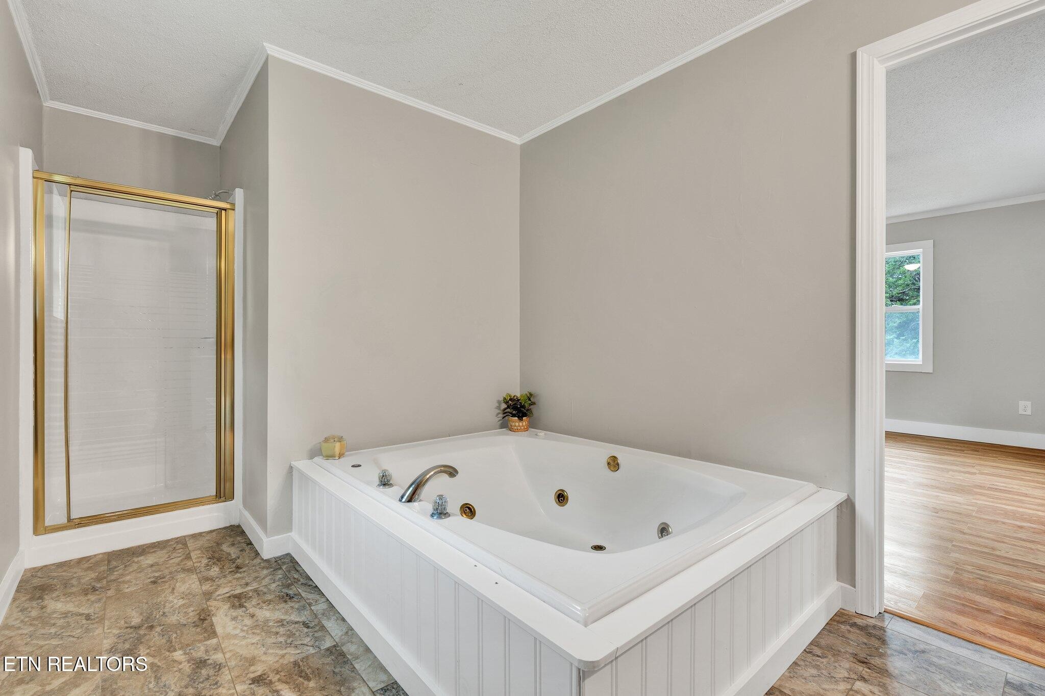 12408 North Nopone Valley Road Decatur, TN 37322 - Photo 17 of 54 a white bath tub sitting in a bathroom