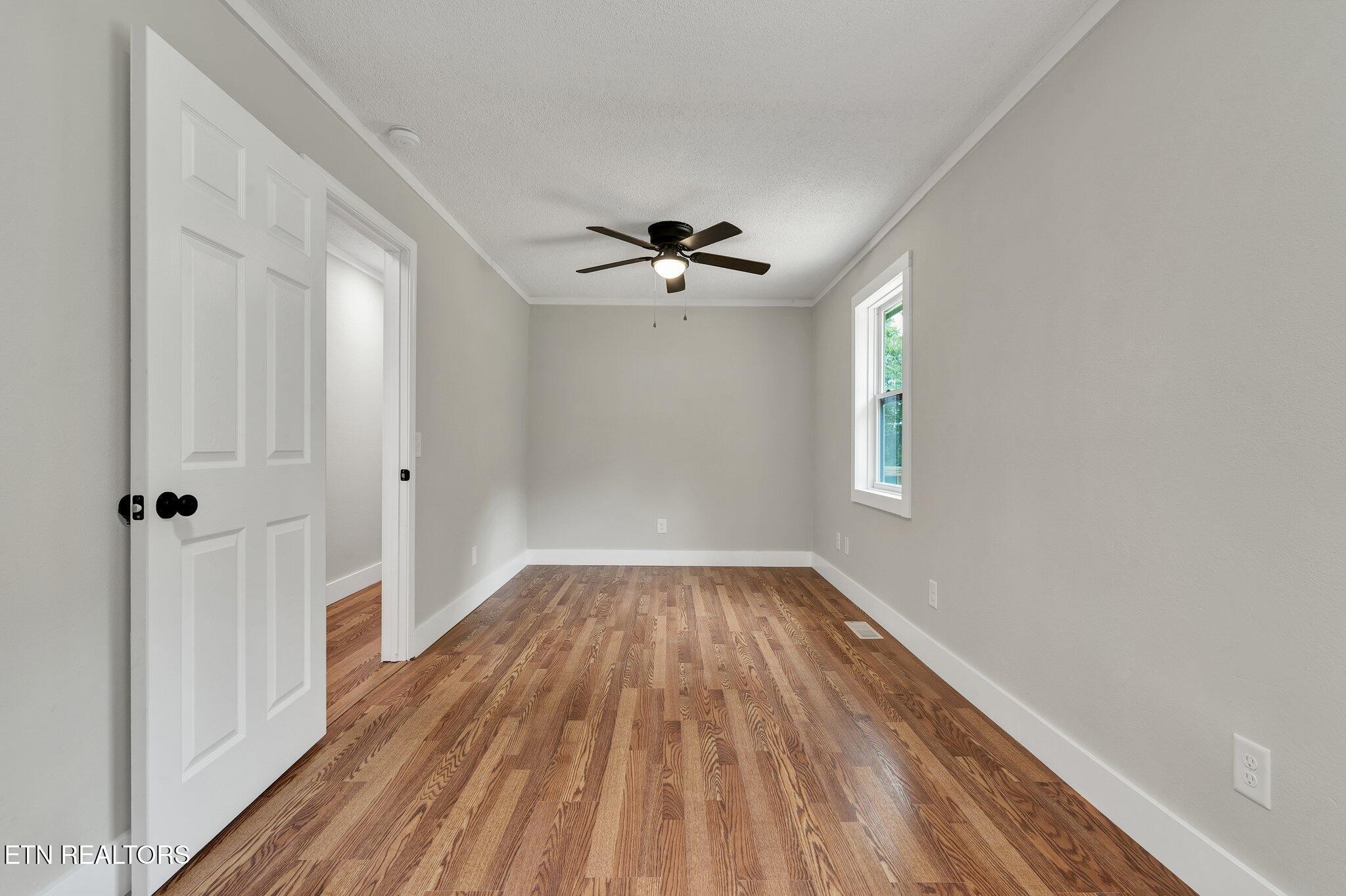 12408 North Nopone Valley Road Decatur, TN 37322 - Photo 26 of 54 wooden floor in an empty room with a window
