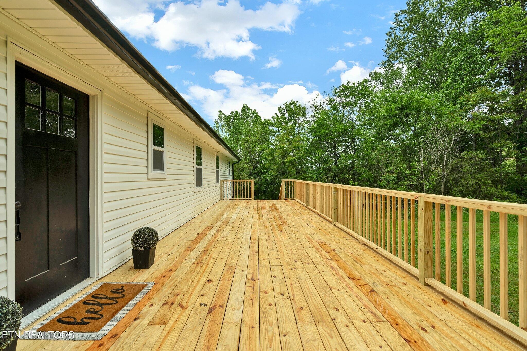12408 North Nopone Valley Road Decatur, TN 37322 - Photo 3 of 54 a view of balcony and wooden floor