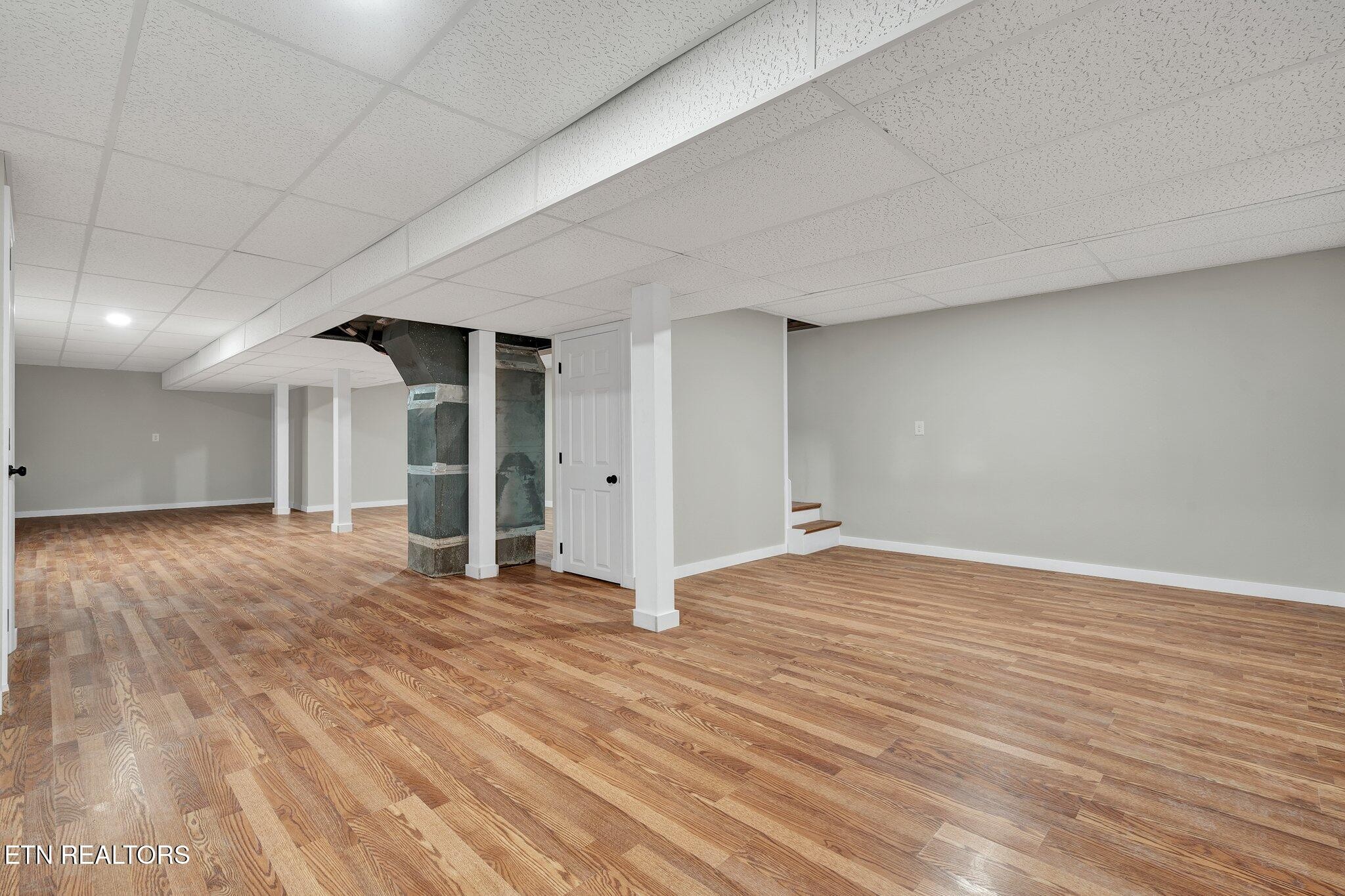 12408 North Nopone Valley Road Decatur, TN 37322 - Photo 43 of 54 a view of empty room with wooden floor