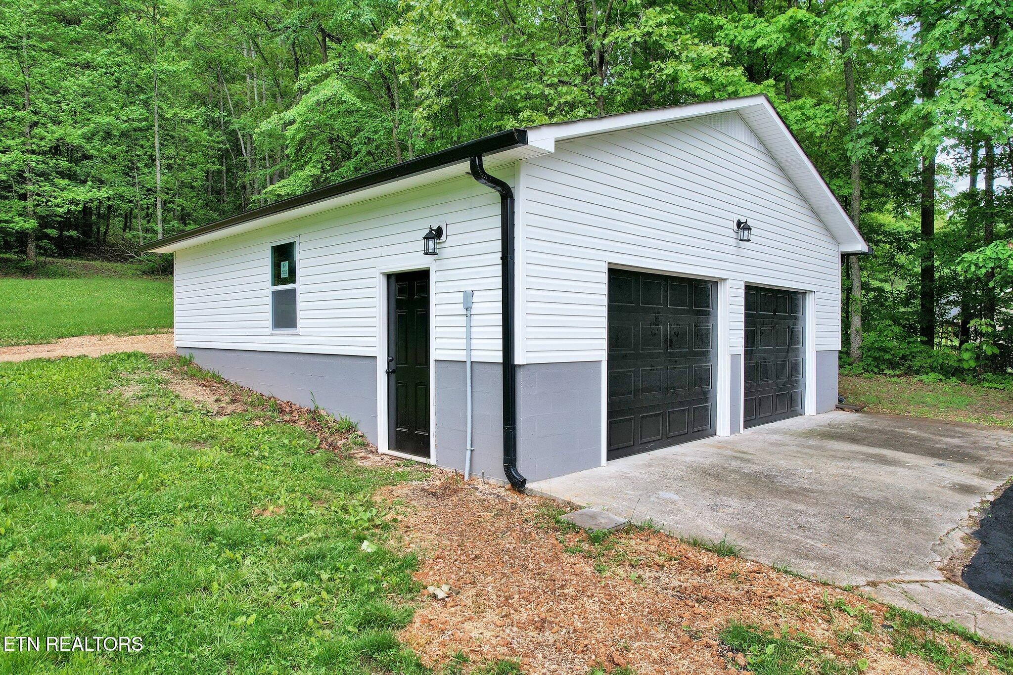 12408 North Nopone Valley Road Decatur, TN 37322 - Photo 46 of 54 a view of a house with yard and a garden