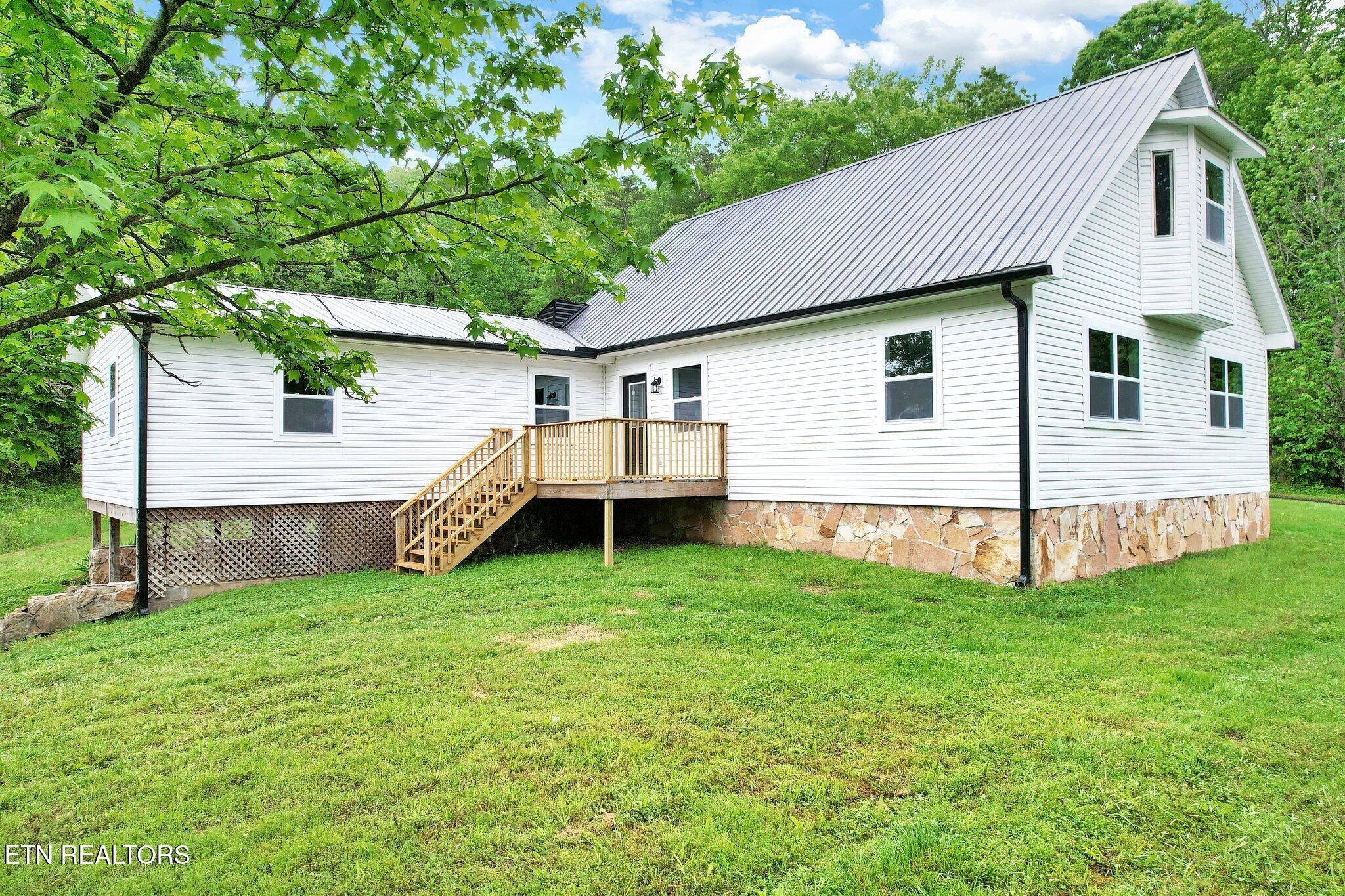 12408 North Nopone Valley Road Decatur, TN 37322 - Photo 51 of 54 a view of a house with backyard