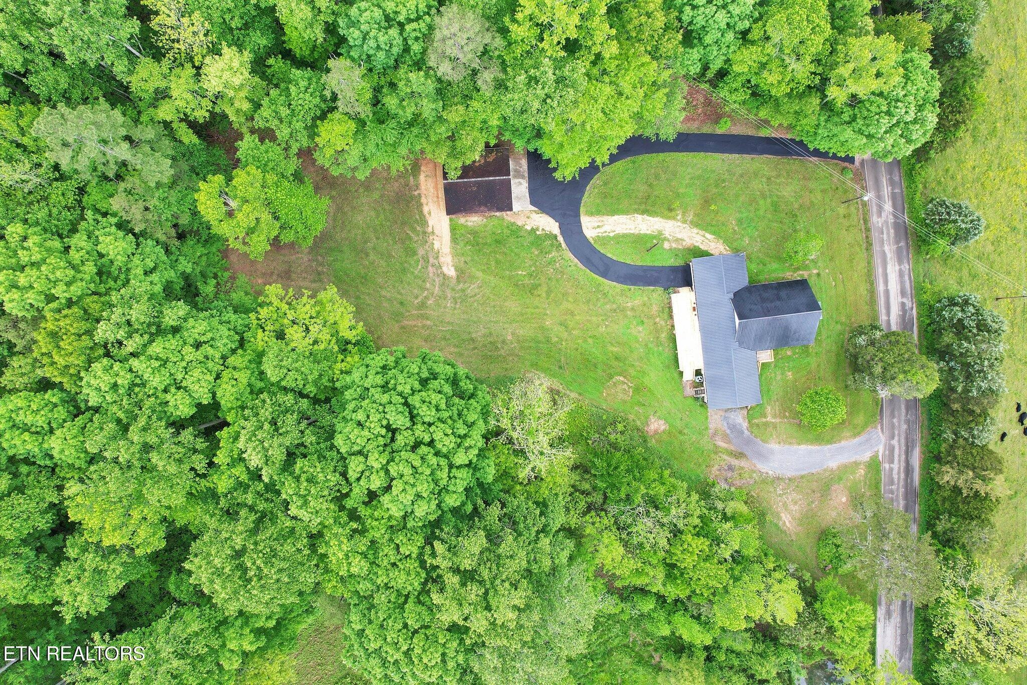 12408 North Nopone Valley Road Decatur, TN 37322 - Photo 53 of 54 an aerial view of a house with a yard and lake view