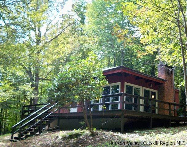 357 Deer Run Road Roxbury, NY 12421 - Photo 8 of 18 a front view of a house with a yard