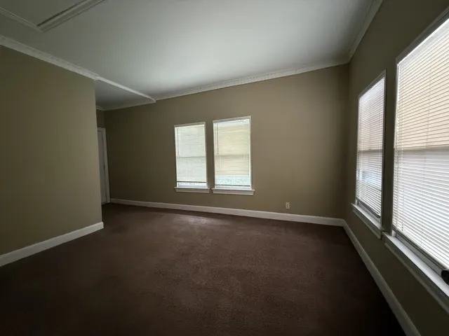 an empty room with a empty space and a window