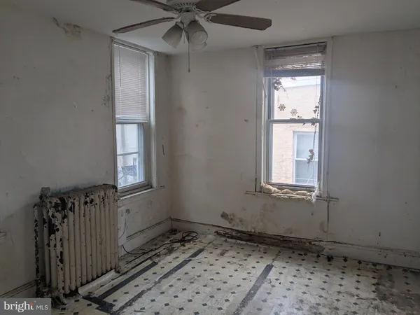 a bathroom with a shower and a sink