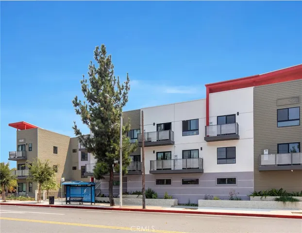 a view of a kitchen with granite countertop cabinets and a wooden floor