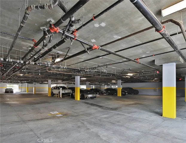 a view of a room with wooden floor and window