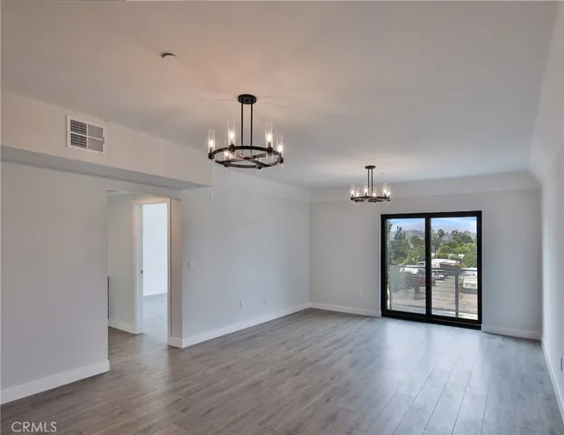 a kitchen with stainless steel appliances a sink and a refrigerator