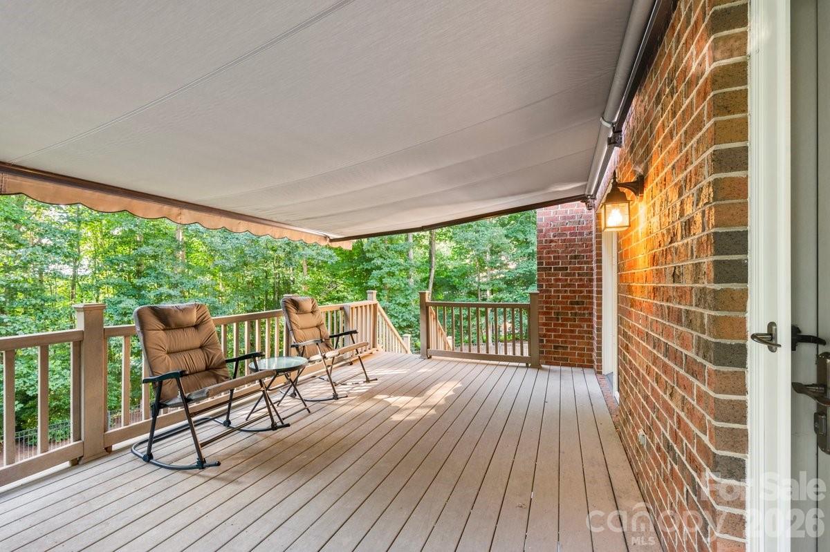207 Lost Corner Road Morganton, NC 28655 - Photo 27 of 46 a view of a chairs and table on the wooden floor