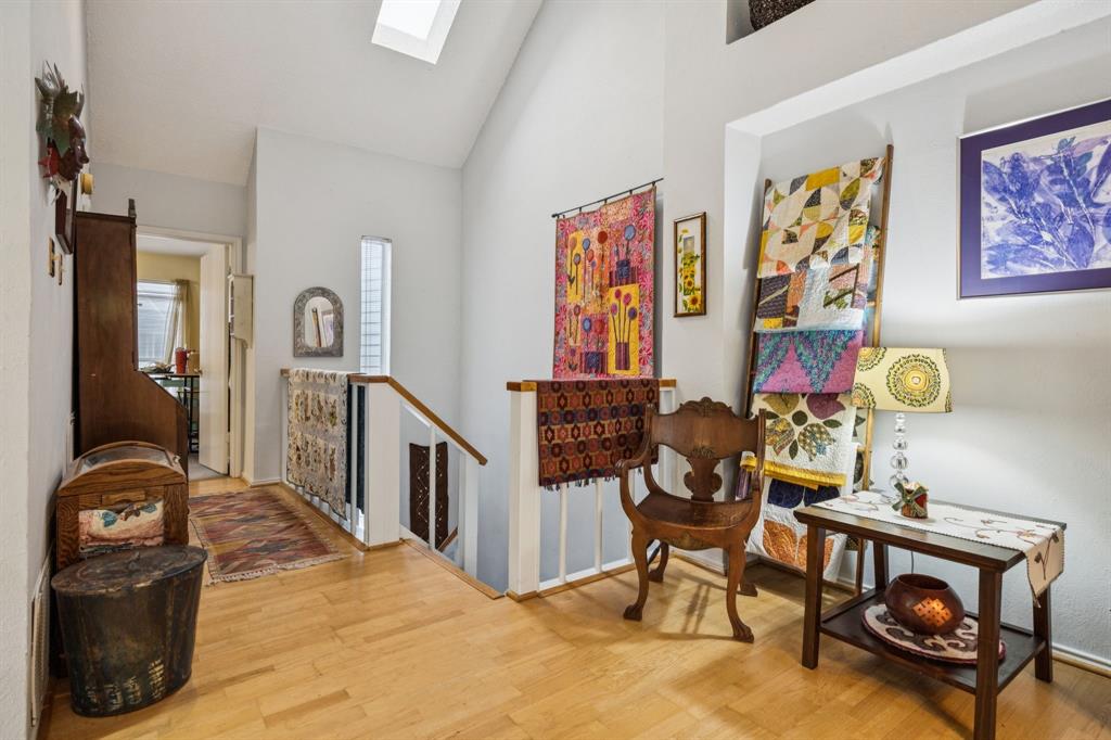 9222 Church Road, Unit 108 Dallas, TX 75231 - Photo 12 of 27 a living room with furniture and wooden floor