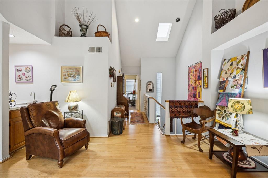9222 Church Road, Unit 108 Dallas, TX 75231 - Photo 13 of 27 a living room with furniture and wooden floor
