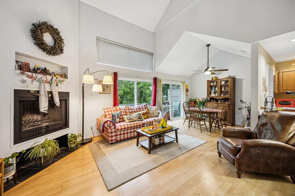 9222 Church Road, Unit 108 Dallas, TX 75231 - Photo 14 of 27 a living room with furniture and a fireplace