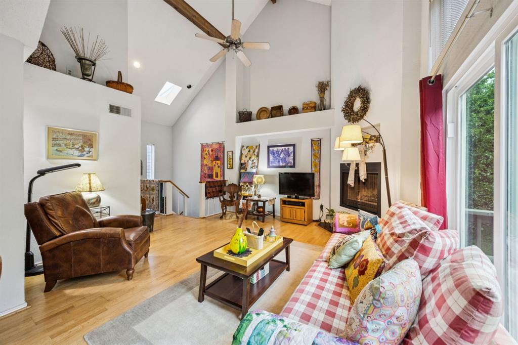 9222 Church Road, Unit 108 Dallas, TX 75231 - Photo 15 of 27 a living room with patio furniture and a flat screen tv