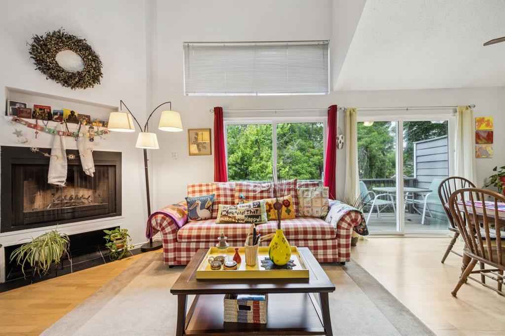 9222 Church Road, Unit 108 Dallas, TX 75231 - Photo 16 of 27 a living room with furniture lamp and large window