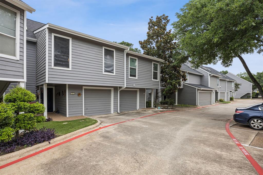9222 Church Road, Unit 108 Dallas, TX 75231 - Photo 2 of 27 a front view of a house with a garden