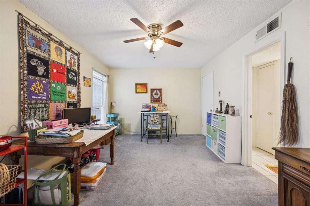 9222 Church Road, Unit 108 Dallas, TX 75231 - Photo 21 of 27 a workspace with furniture and ceiling fan