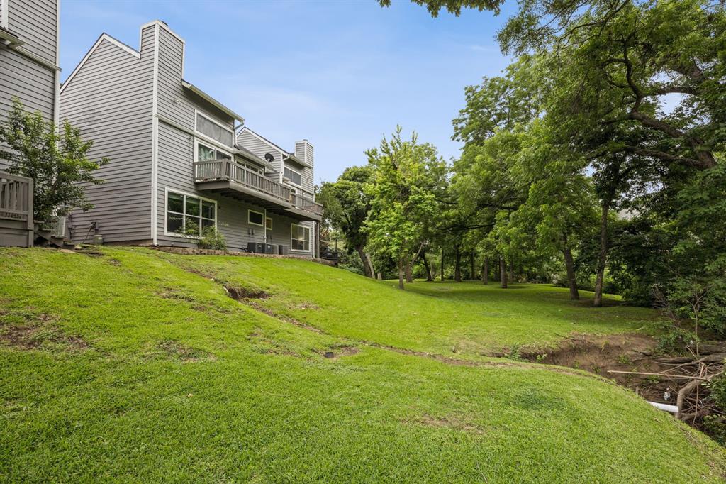 9222 Church Road, Unit 108 Dallas, TX 75231 - Photo 27 of 27 a view of a house with a yard