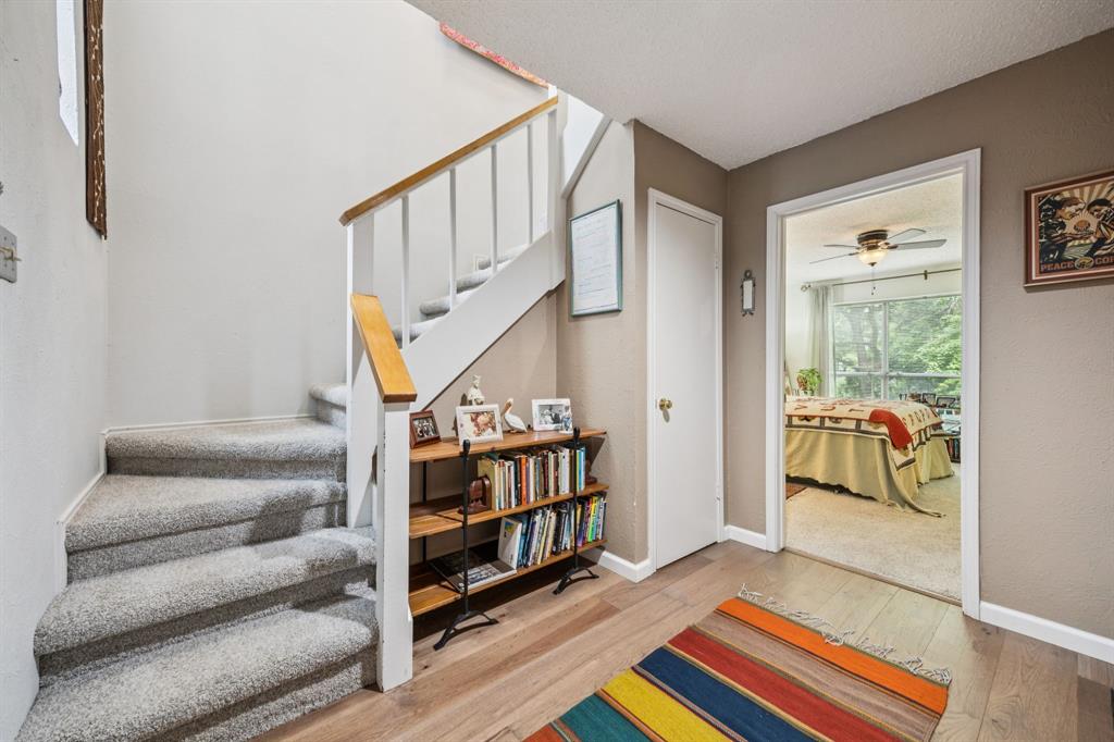 9222 Church Road, Unit 108 Dallas, TX 75231 - Photo 3 of 27 a living room with furniture and a rug