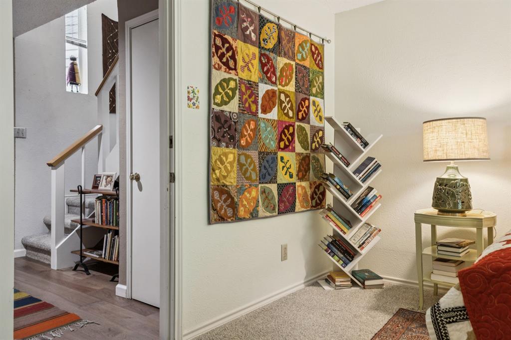 9222 Church Road, Unit 108 Dallas, TX 75231 - Photo 6 of 27 a view of a hallway with workspace and closet