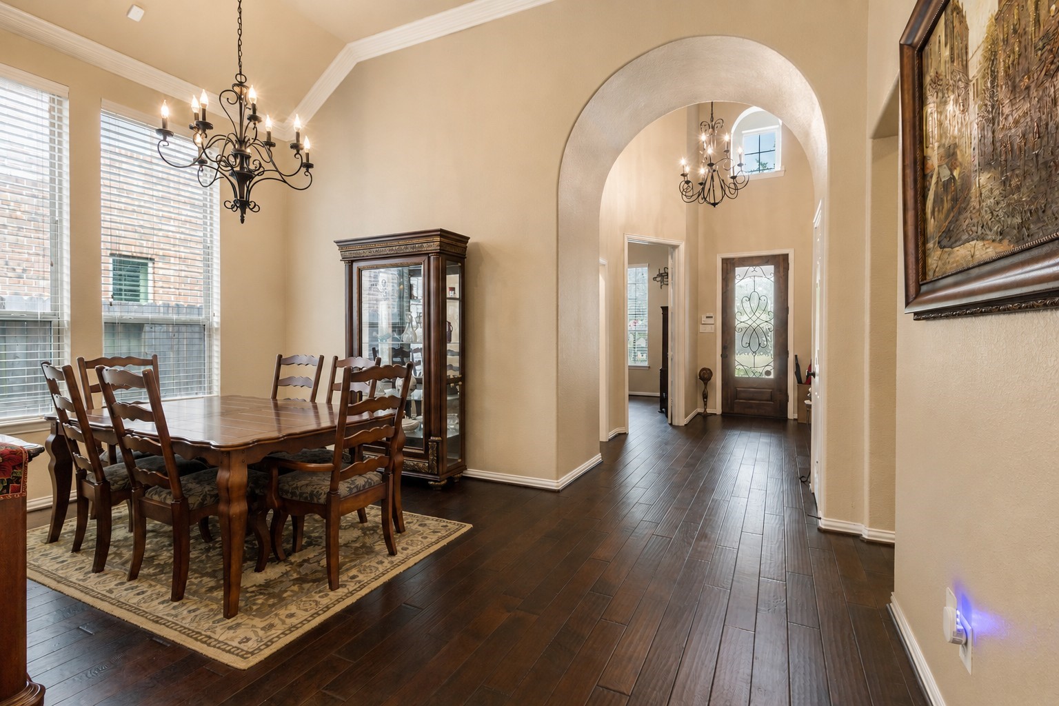 2326 Hamilton Pool Lane Friendswood, TX 77546 - Photo 10 of 49 a view of a dining room with furniture and chandelier