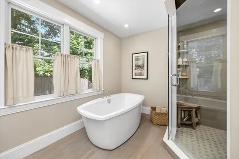 a bathroom with a granite countertop sink a toilet and a large mirror