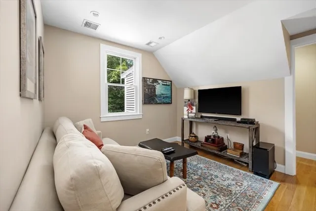 a view of a livingroom with furniture and windows