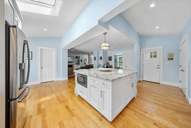 a kitchen with a sink stove and refrigerator