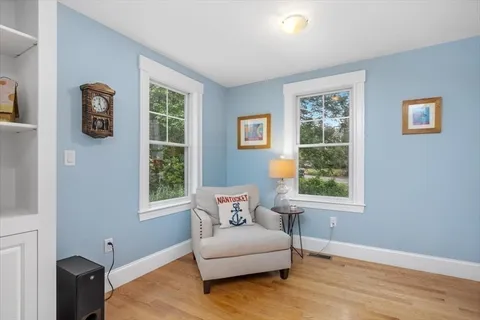 a view of room with wooden floor