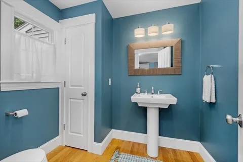 a white bath tub sitting in a bathroom next to a bathroom
