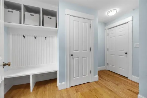 a spacious bedroom with a bed and a flat screen tv