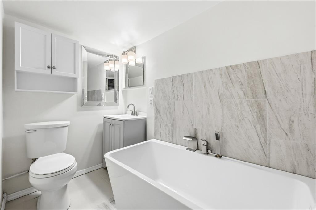 123 Cemetery Road Slippery Rock, PA 16057 - Photo 11 of 33 This beautifully updated brand new bathroom features a sleek freestanding Roman tub.