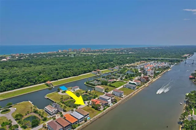 an aerial view of a house with a ocean view