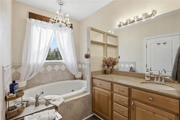 a bedroom with a bed and cabinets