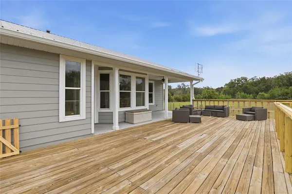 a view of a backyard with swimming pool