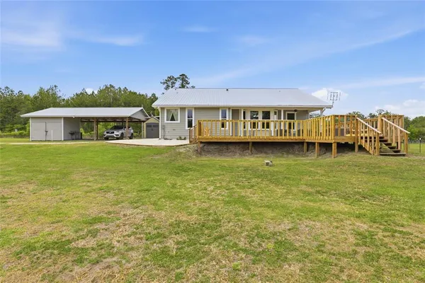 a view of a chair and table in the garden