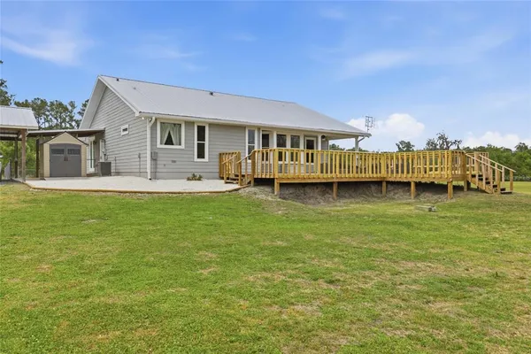 a view of a lake with a house in the background