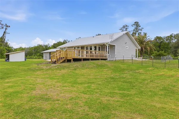 aerial view of a house with pool porch and sitting area